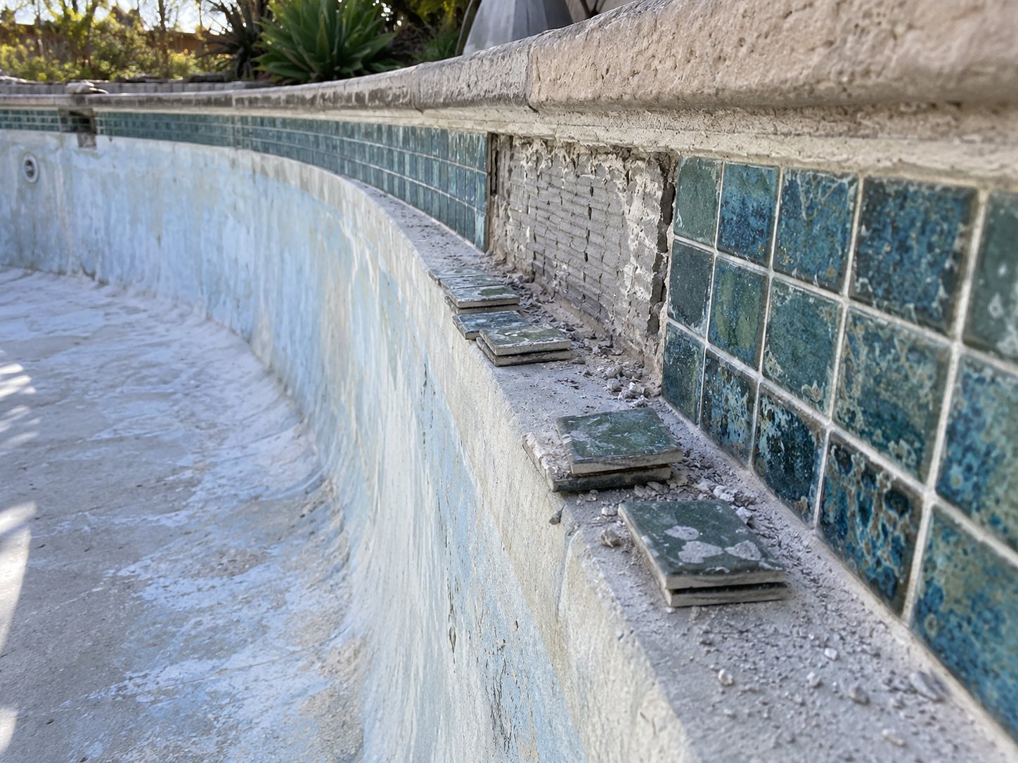 Representative pool surface and tile repair preparation